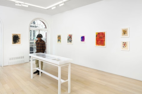 installation view with framed drawings