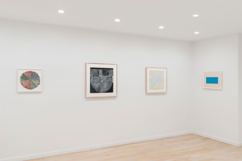 installation view with various framed works