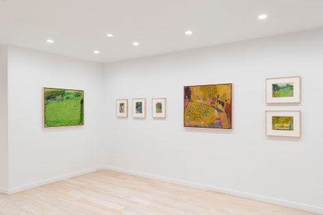 installation view of paintings in a white room