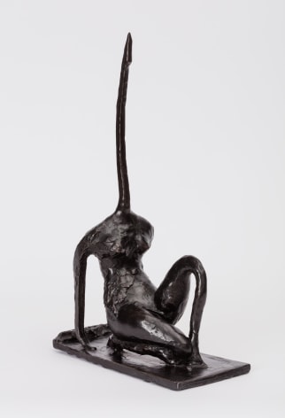 bronze statuette with a long pointy neck