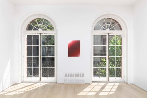 installation view of paintings in a white room