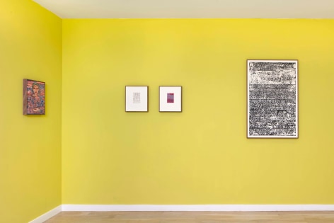 installation view of multiple works on paper and paintings in a yellow room