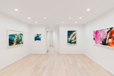 white room with large abstract photos