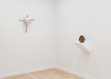 installation view of a white gallery with various sculptures