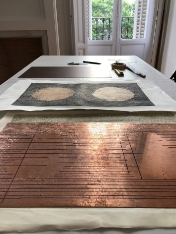 table with a printmaking plate