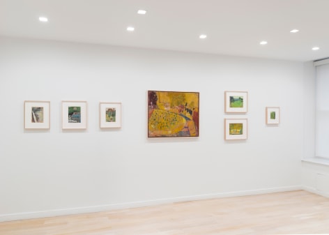 installation view of paintings in a white room