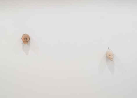 installation view of a white gallery with various sculptures