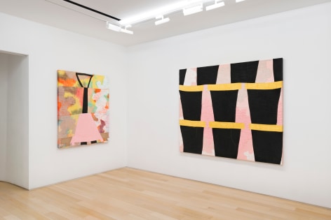 installation view of paintings in a white room