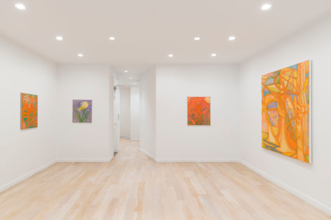 installation view of paintings in a white room