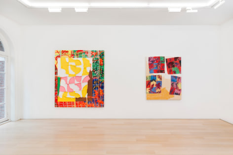 installation view of paintings in a white room