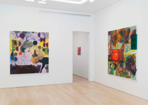 installation view of paintings in a white room