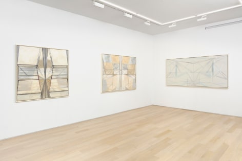 white gallery space with art on walls