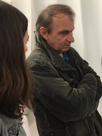 &quot;WELL, IT&#039;S TOURISM...&quot; MICHEL HOUELLEBECQ LACONICALLY DESCRIBING HIS ART TO LSP&#039;S PRUNE PERROMAT AT THE OPENING OF HIS FIRST US ART SHOW &quot;FRENCH BASHING&quot; IN NEW YORK ON FRIDAY NIGHT.&nbsp;PHOTO CREDIT: JOEL WHITNEY