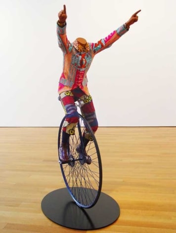 YINKA SHONIBARE, Child on Unicycle, 2005. Life-size fiberglass mannequin, Dutch wax-printed cotton, steel