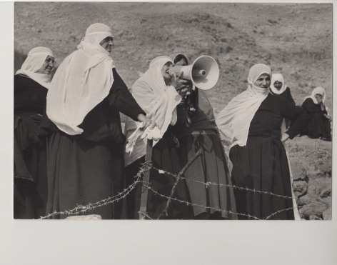 MICHA BAR-AM, Druse Women on Golan Heights Communicate with their Families on the Syrian Side Across the Border Fence, 1975