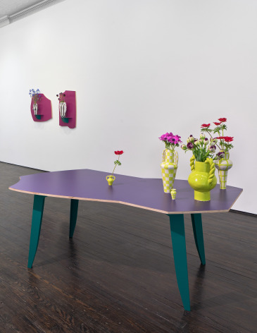 Installation view of ceramic vases on table