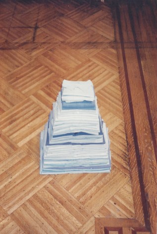 folded work shirts on gallery floor