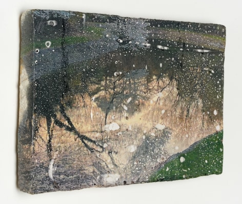 Lyric Shen photograph of tree reflections on water that has been water transferred onto a ceramic slab view from the side.