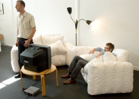 White blow up couch with tv