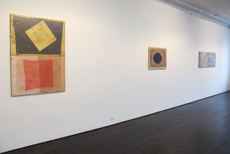 Gallery view of three abstract paintings