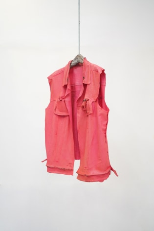 Jeff Williams Sleeveless denim pink latex vest cast from rubber mold suspended on hanger.