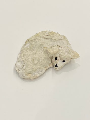 Small curled up dog sculpture