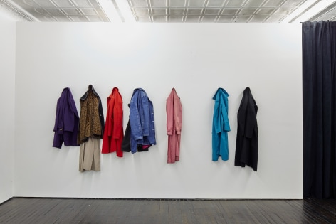 Gallery view of coats hanging on gallery walls