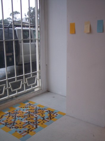installation view of geometric work by gallery window