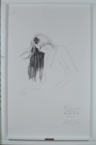 Woman bending over, drawing