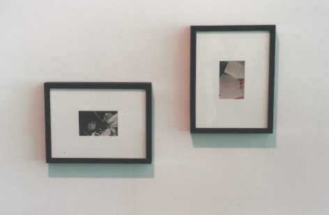 Two framed photos of hands