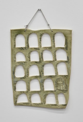 Hung ceramic piece resembling aqueduct