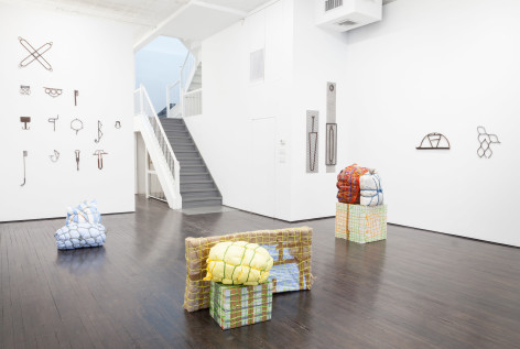 Maia Ruth Lee gallery view, featuring tool sculptures on  gallery walls and floor pieces