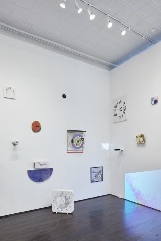 Installation view of small and varied works related to time