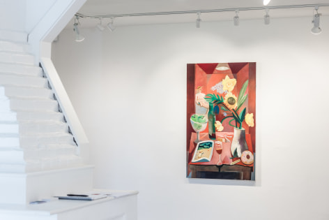 Installation view of red hued painting