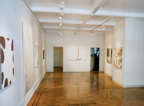 Install view of various abstract paintings