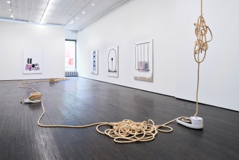 Install view of rope sculpture and abstract paintings