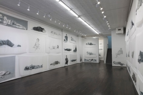 Installation view of Hours, with several dyed silk pieces