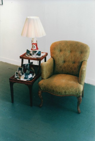 Closeup of chair with table and lamp