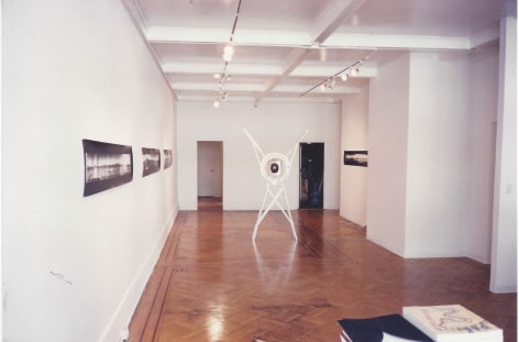 installation view with camera and panorama photos