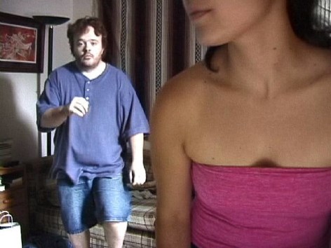 Still of woman and man in apartment