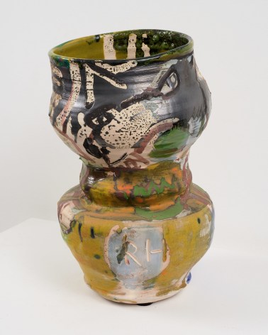 tilting pot with figure on it