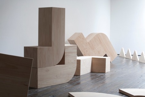 Installation view of wooden block sculptures