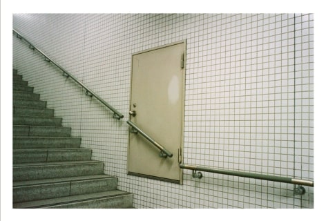 Photo of underground door placed above staircase