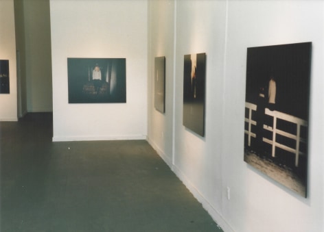 Installation view of dark photographs