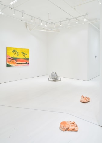feet sculptures and yellow painting