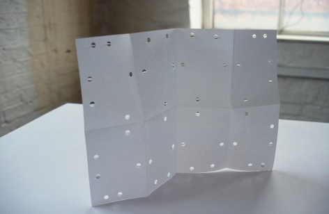 Hughes, paper work with cutout holes