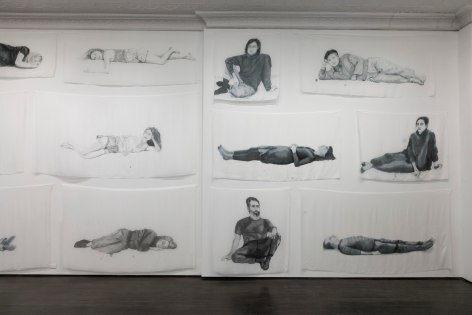 Installation view of Hours, with several dyed silk pieces hanging on gallery walls