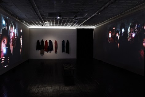 Installation view of projector images on gallery walls