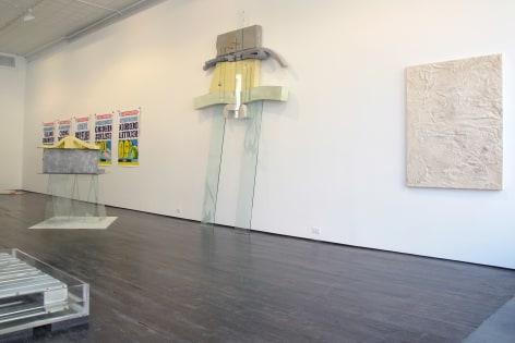 Gallery view of painting, posters, and various sculptural pieces