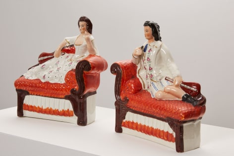 Amy Douglas painted ceramics, figures reclining on sofa